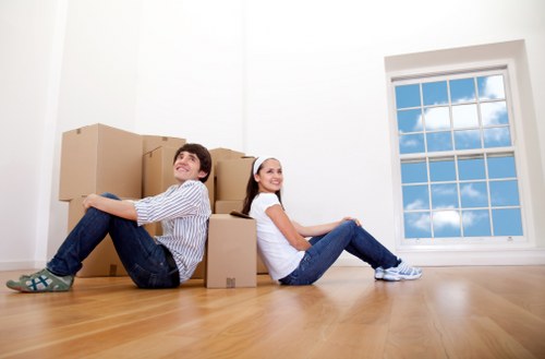 Staff training removals team carrying furniture safely