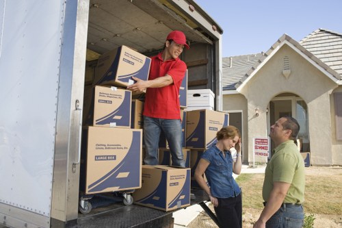 Professional short-notice moving service preparing boxes and furniture for transport