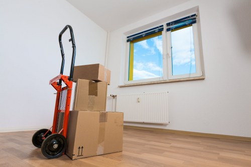 Professional team handling office equipment during a Maidavale commercial move