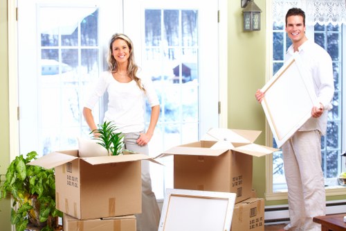 Professional movers packing household items for a Maidavale relocation